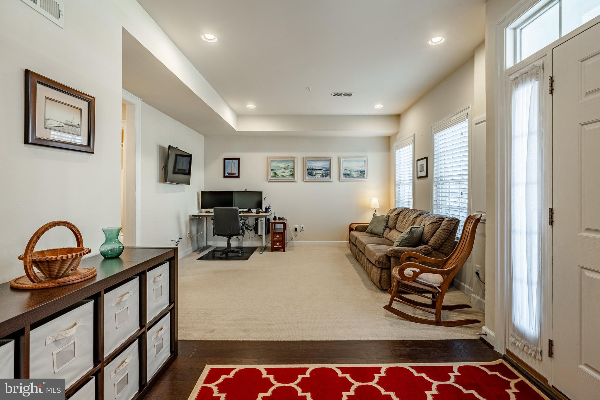 408 Atwater Drive Malvern, PA 19355 - Photo 36 of 49 a living room with furniture a rug and a window