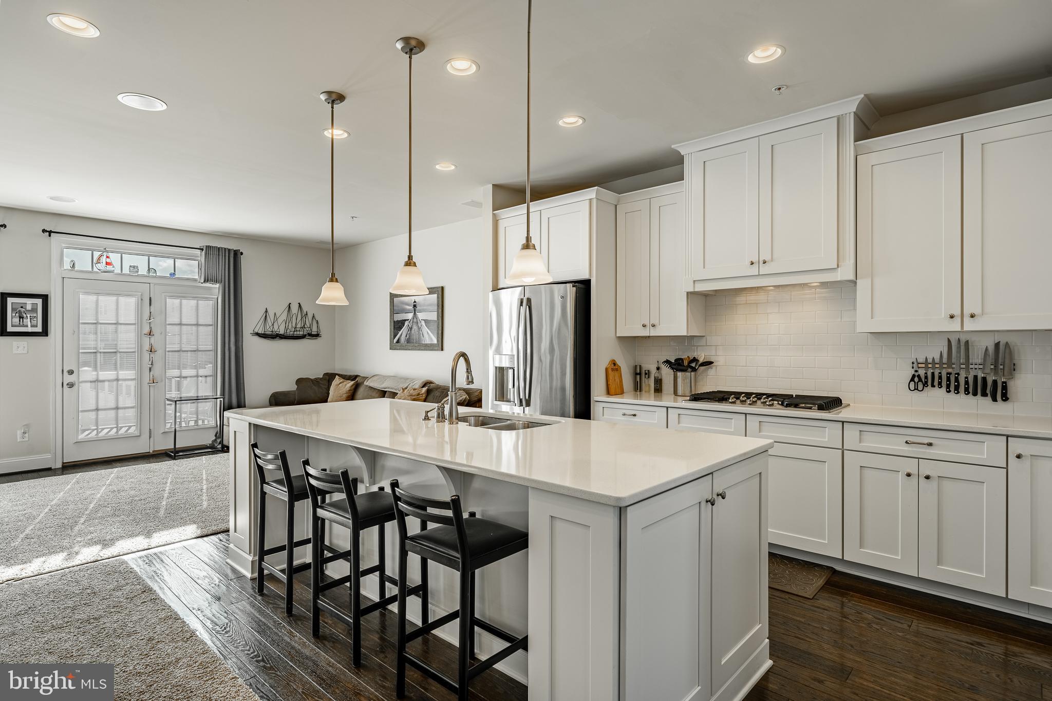 408 Atwater Drive Malvern, PA 19355 - Photo 6 of 49 a kitchen with stainless steel appliances granite countertop a sink a stove a refrigerator and island with wooden floor
