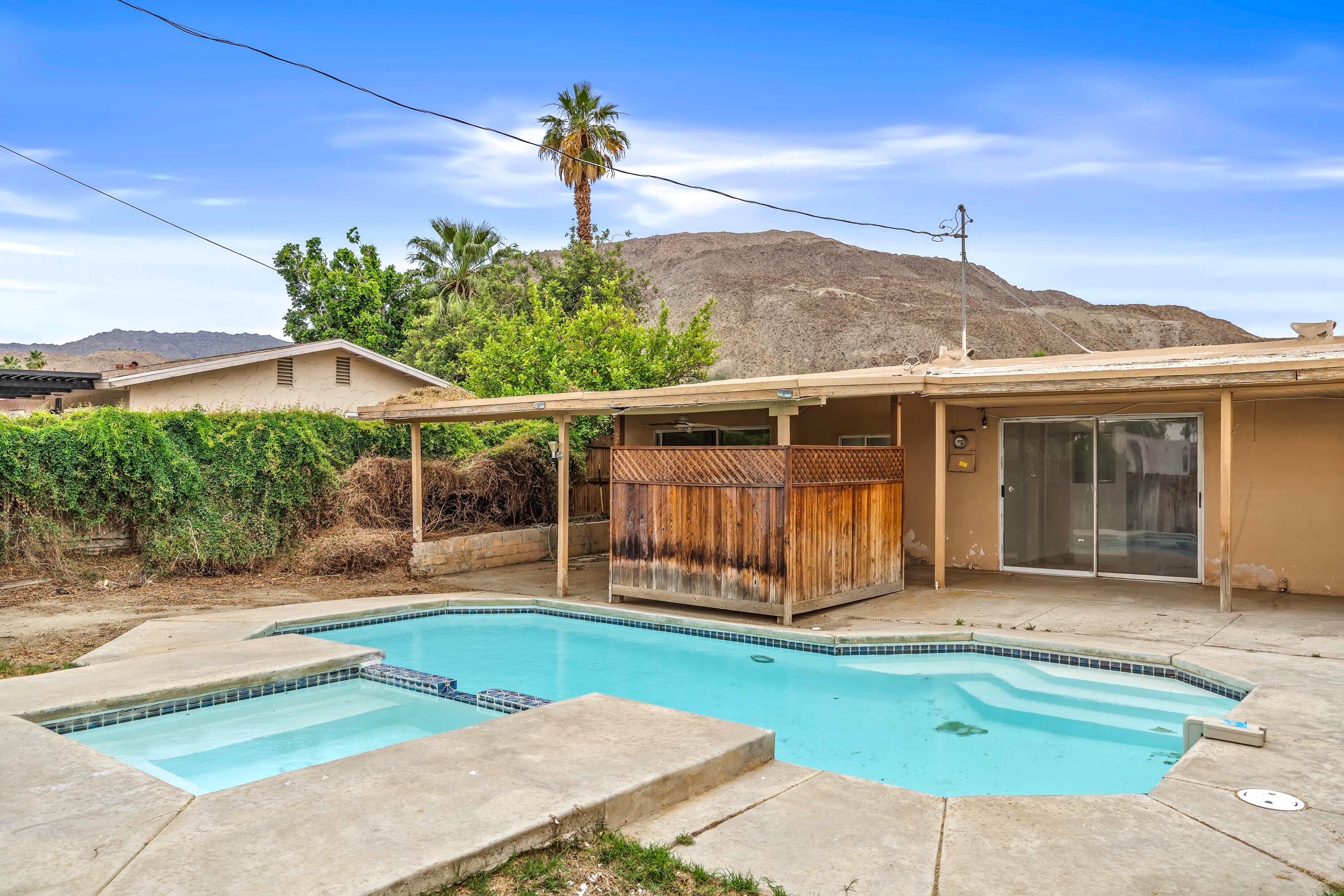 43831 Joshua Road Palm Desert, CA 92260 - Photo 1 of 42 a front view of a house with garden