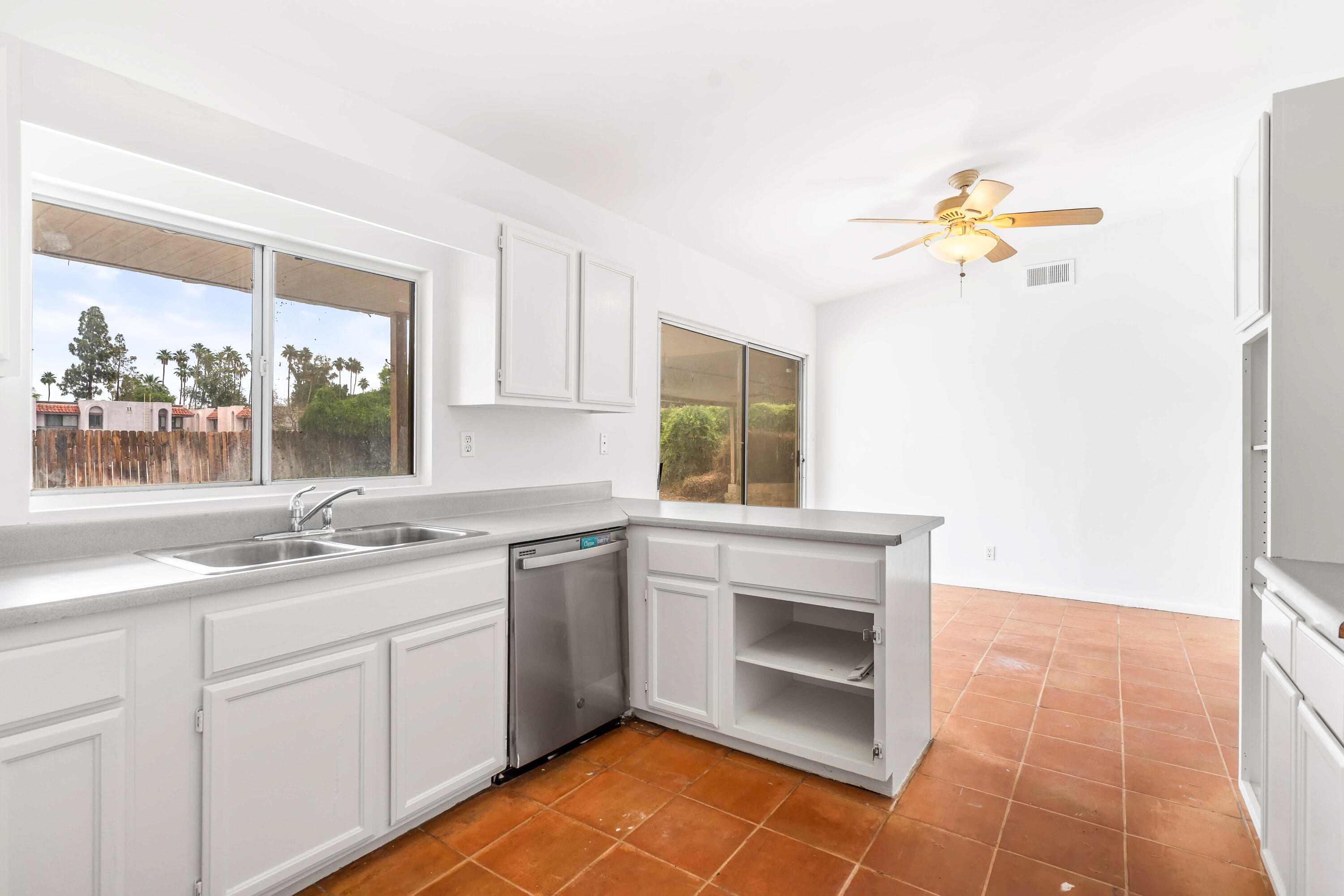 43831 Joshua Road Palm Desert, CA 92260 - Photo 12 of 42 a kitchen with a sink cabinets and window
