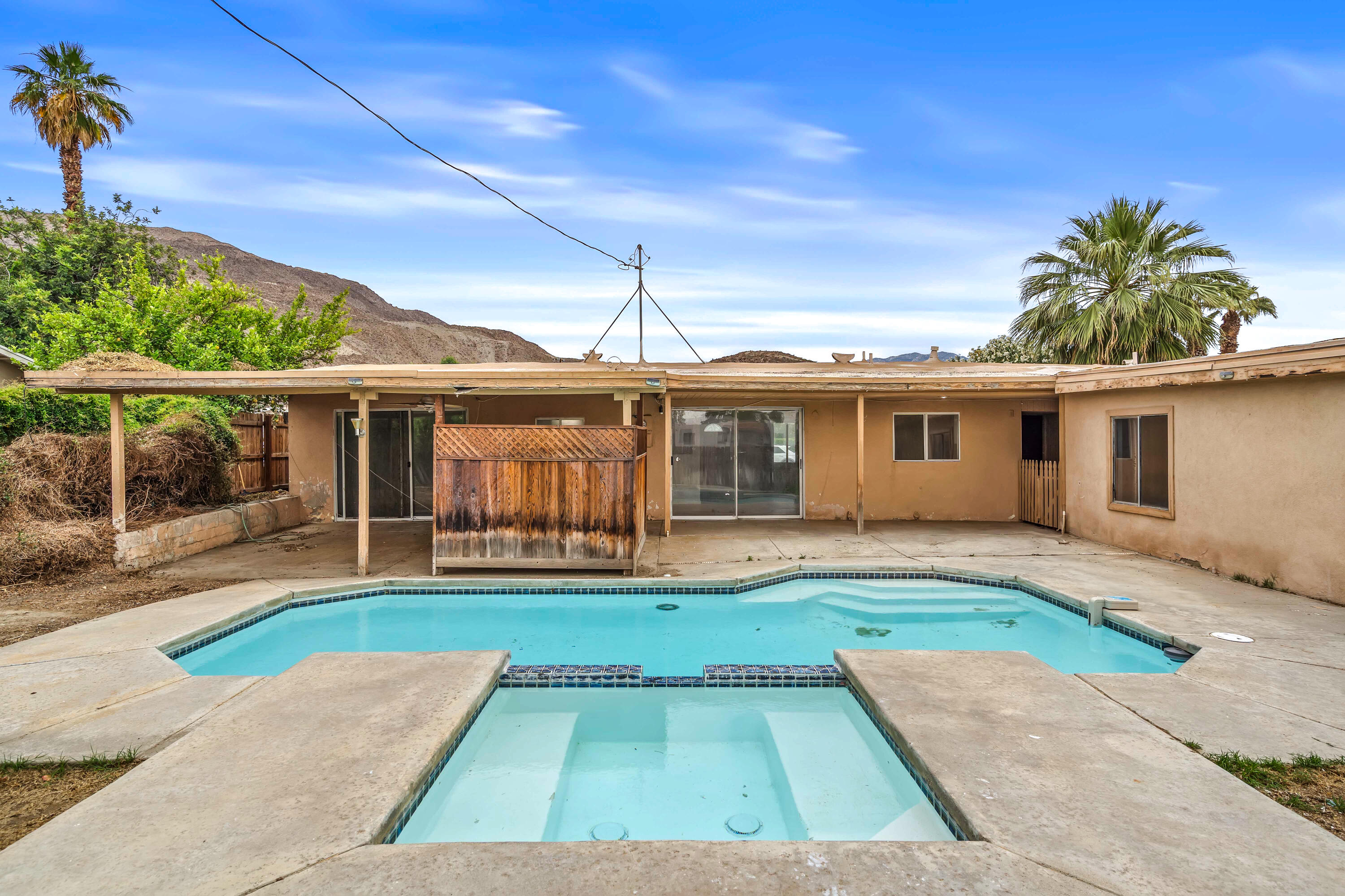 43831 Joshua Road Palm Desert, CA 92260 - Photo 23 of 42 a view of a house with a yard and sitting area