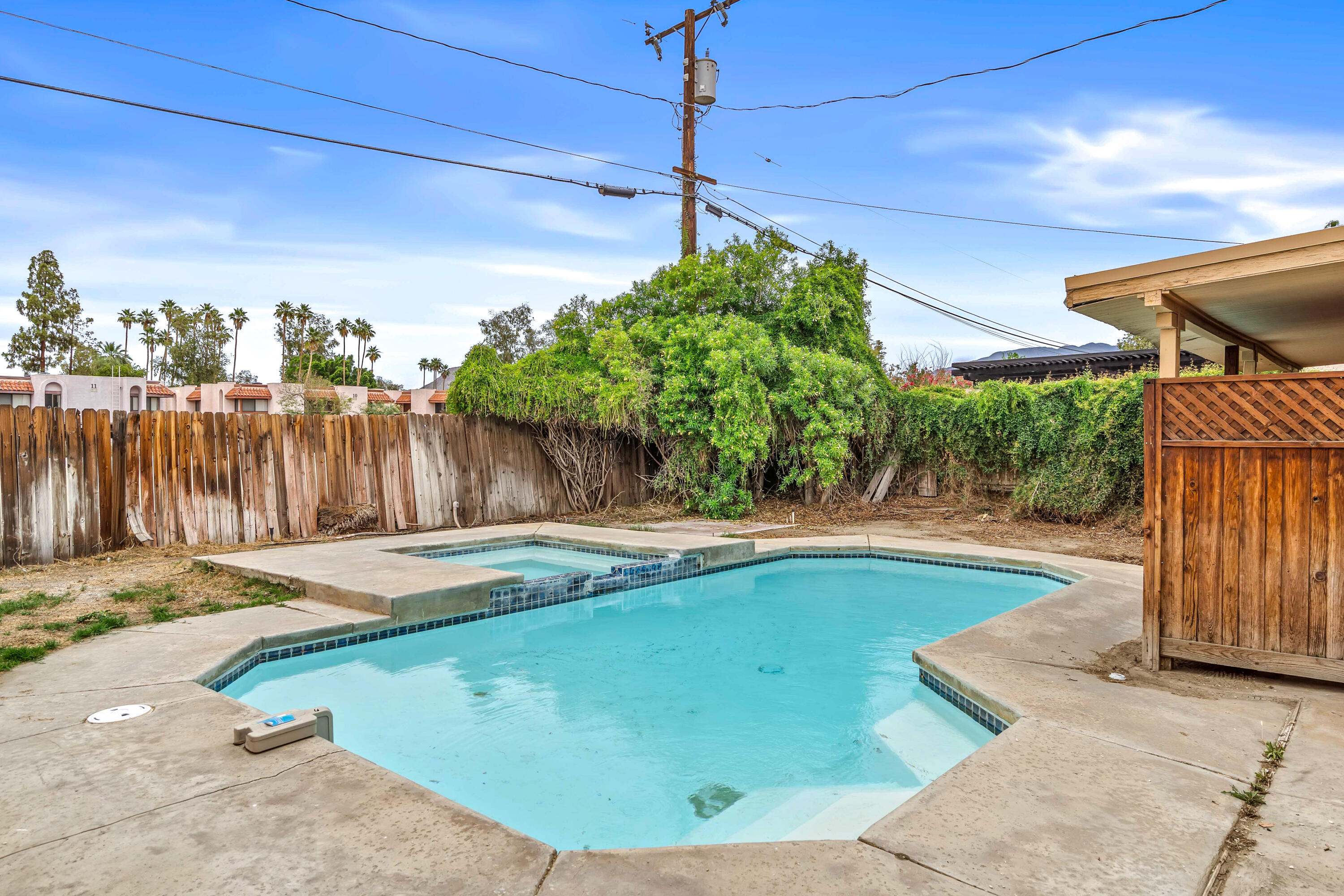 43831 Joshua Road Palm Desert, CA 92260 - Photo 27 of 42 a view of a backyard with wooden fence