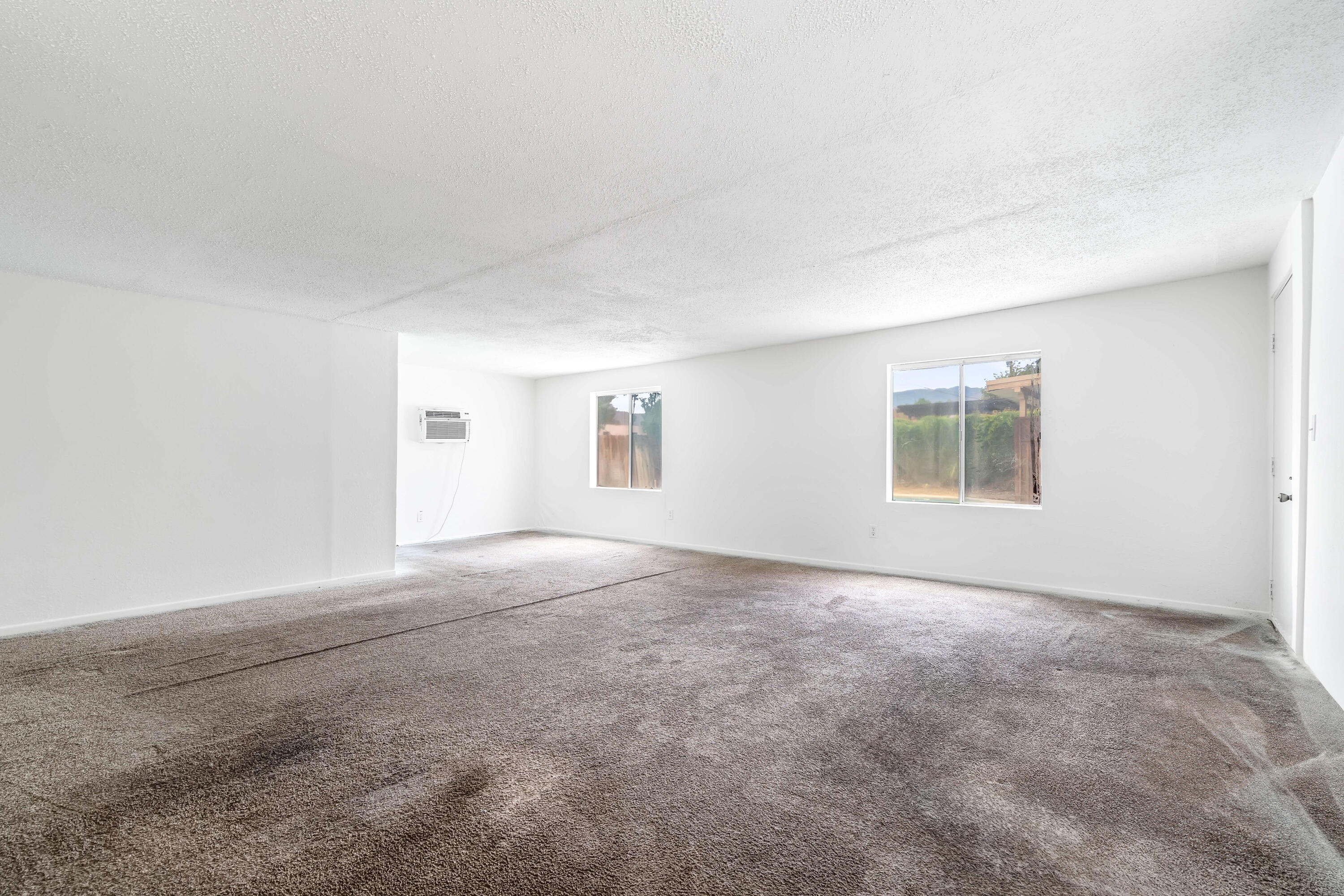 43831 Joshua Road Palm Desert, CA 92260 - Photo 30 of 42 an empty room with windows
