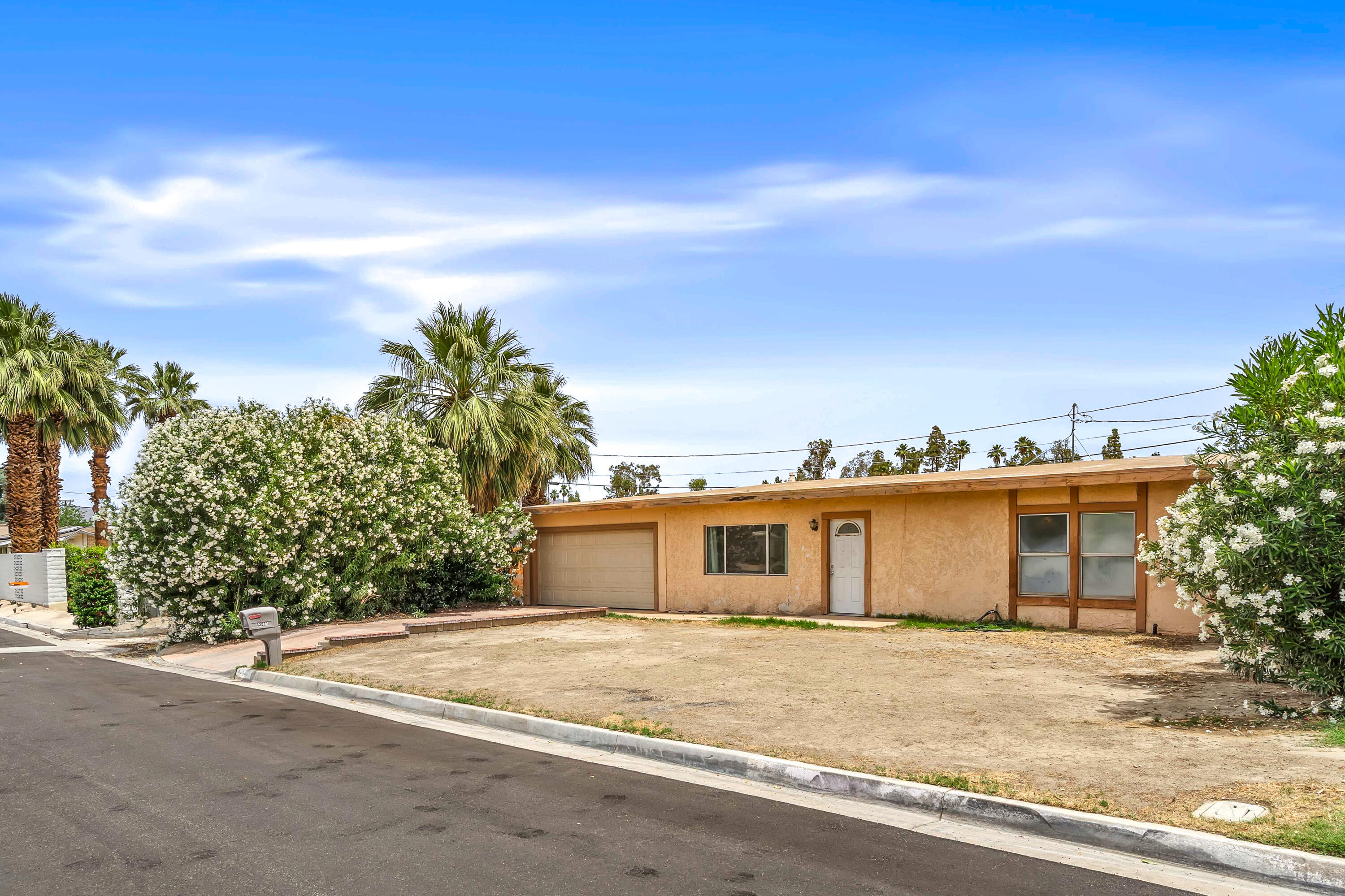 43831 Joshua Road Palm Desert, CA 92260 - Photo 40 of 42 front view of a house with a space