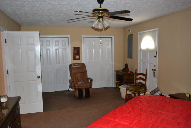 1949 Bonner Gilbert Road Macon, GA 31220 - Photo 11 of 15 a bedroom with bed and a chandelier