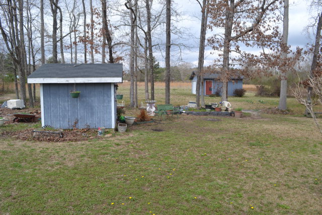 1949 Bonner Gilbert Road Macon, GA 31220 - Photo 15 of 15 a backyard of a house with trees and outdoor seating