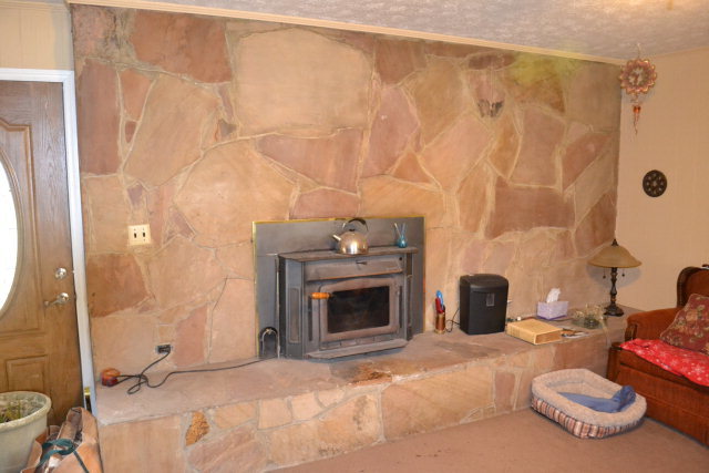 1949 Bonner Gilbert Road Macon, GA 31220 - Photo 5 of 15 a living room with furniture and a fireplace