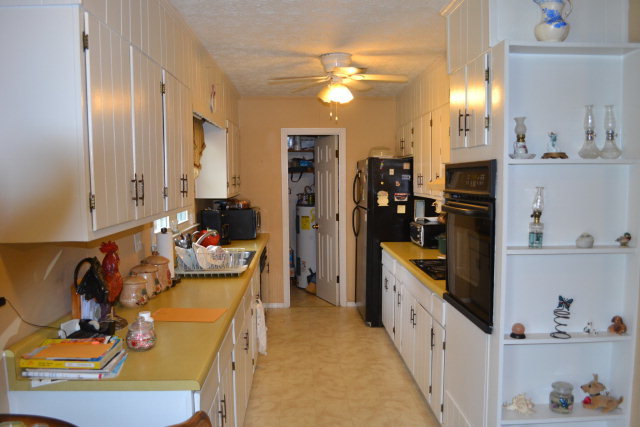 1949 Bonner Gilbert Road Macon, GA 31220 - Photo 8 of 15 a large kitchen with stainless steel appliances granite countertop a refrigerator and stove