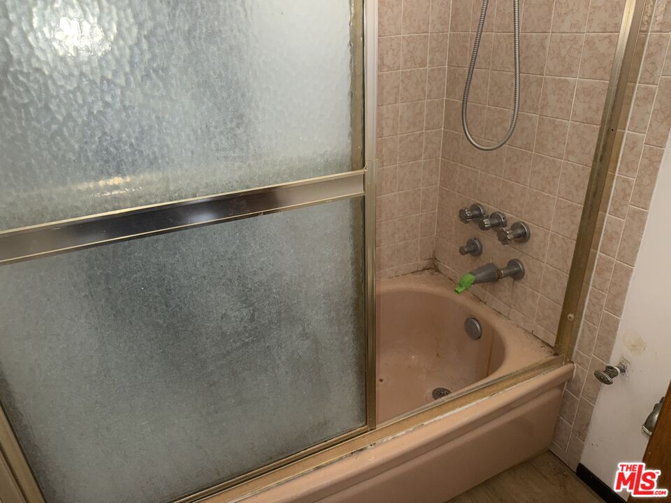 904 North 1st Street Alhambra, CA 91801 - Photo 11 of 17 a bathroom with a bathtub and shower