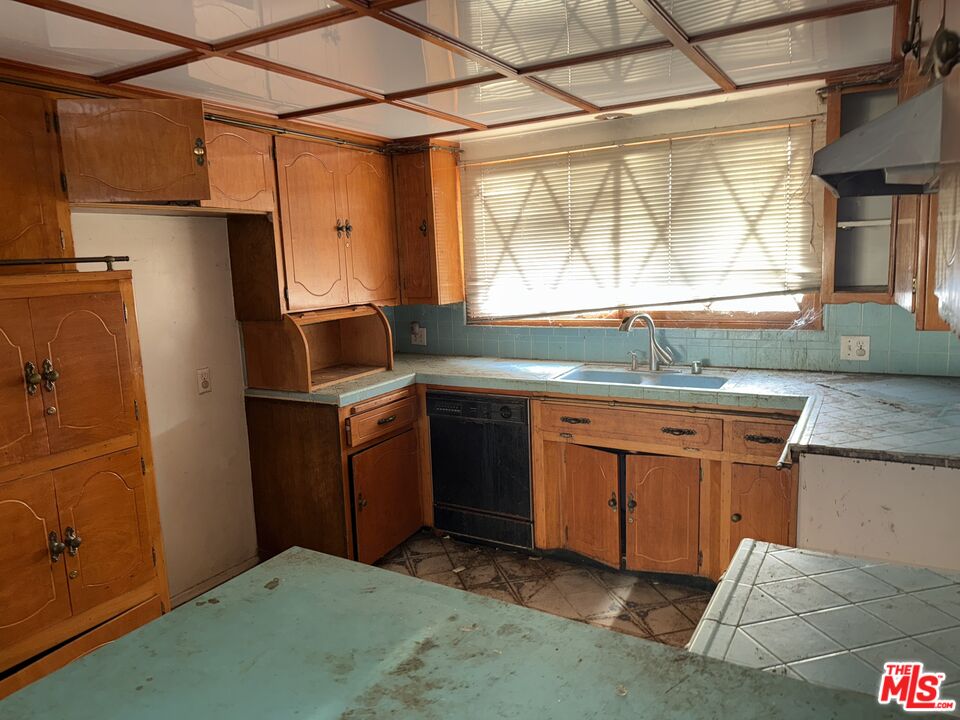 904 North 1st Street Alhambra, CA 91801 - Photo 8 of 17 a kitchen with a sink stove and refrigerator