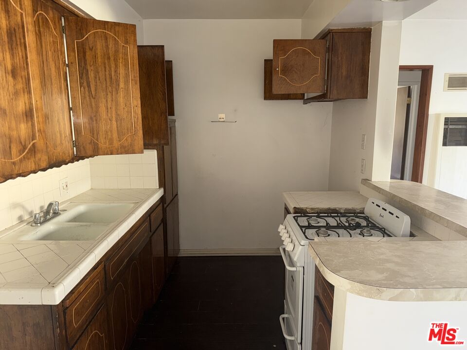 904 North 1st Street Alhambra, CA 91801 - Photo 9 of 17 a bathroom with a sink and a mirror
