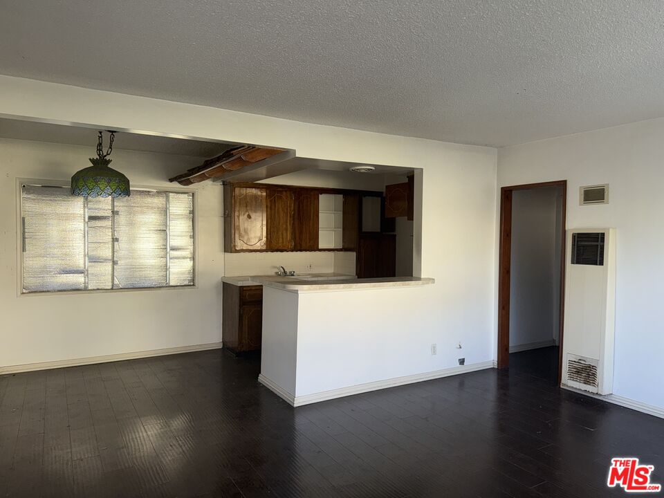 904 North 1st Street Alhambra, CA 91801 - Photo 10 of 17 an empty room with wooden floor and windows