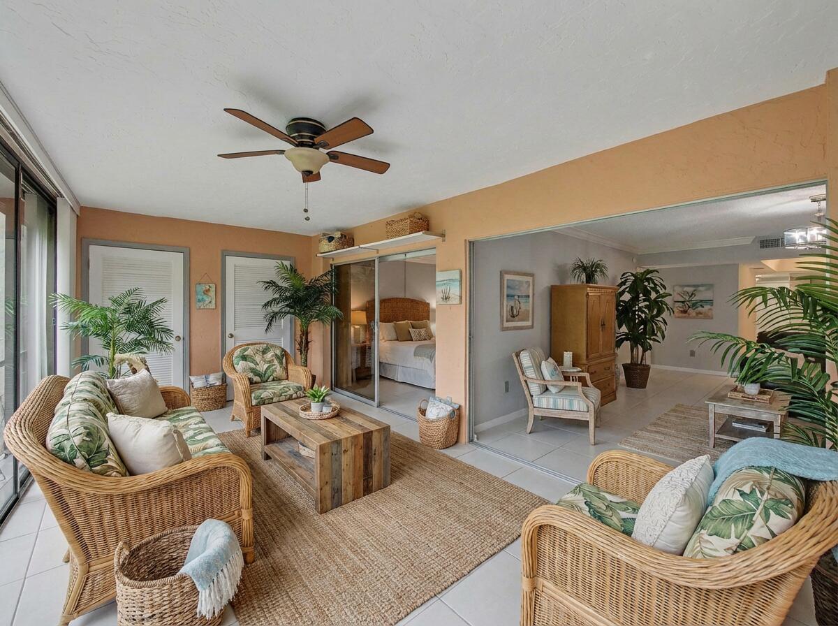 9220 Southwest 14th Street, Unit 3103 Boca Raton, FL 33428 - Photo 19 of 27 a living room with furniture and a rug