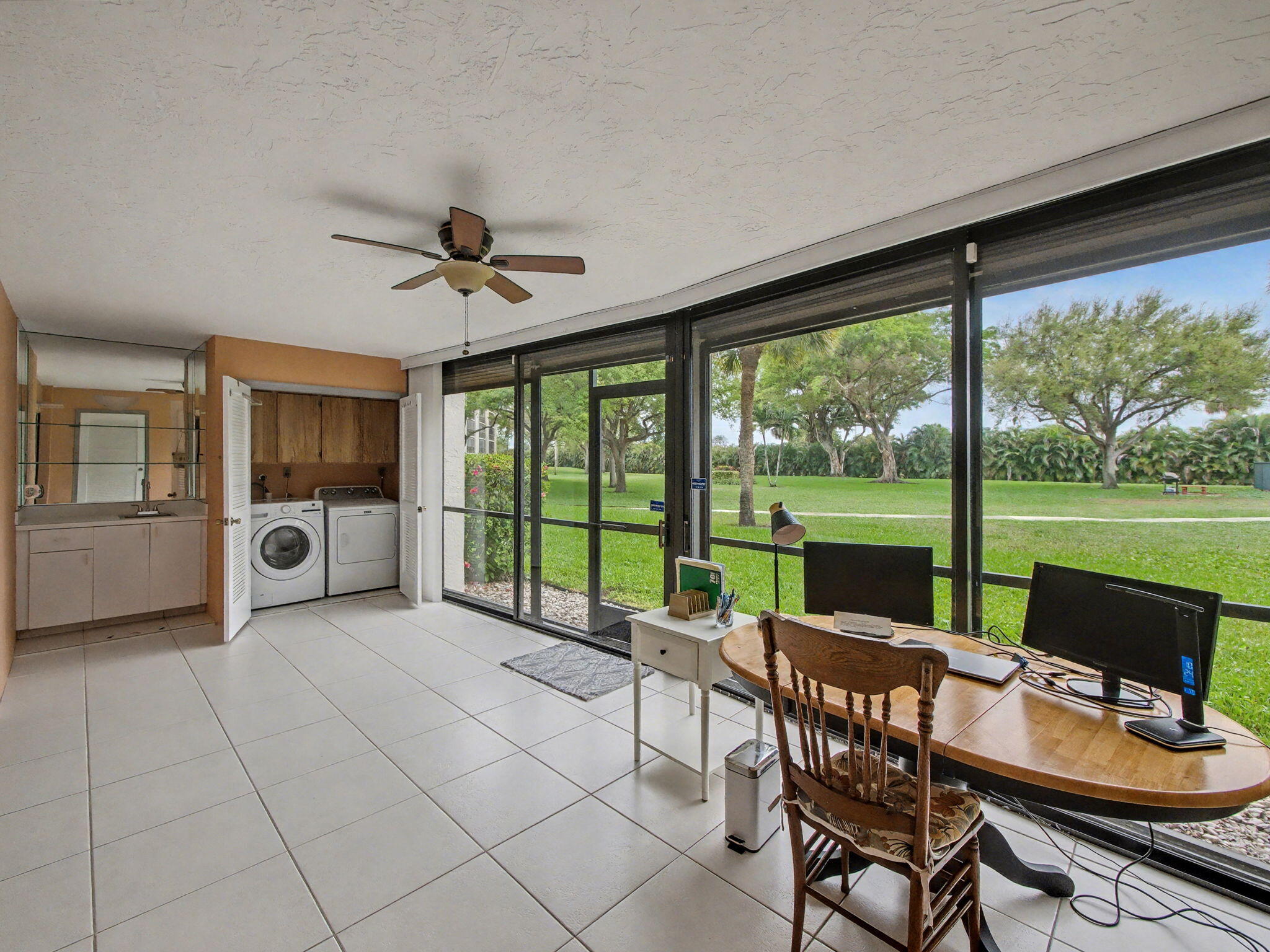 9220 Southwest 14th Street, Unit 3103 Boca Raton, FL 33428 - Photo 20 of 27 a view of a dining room with furniture window and outside view