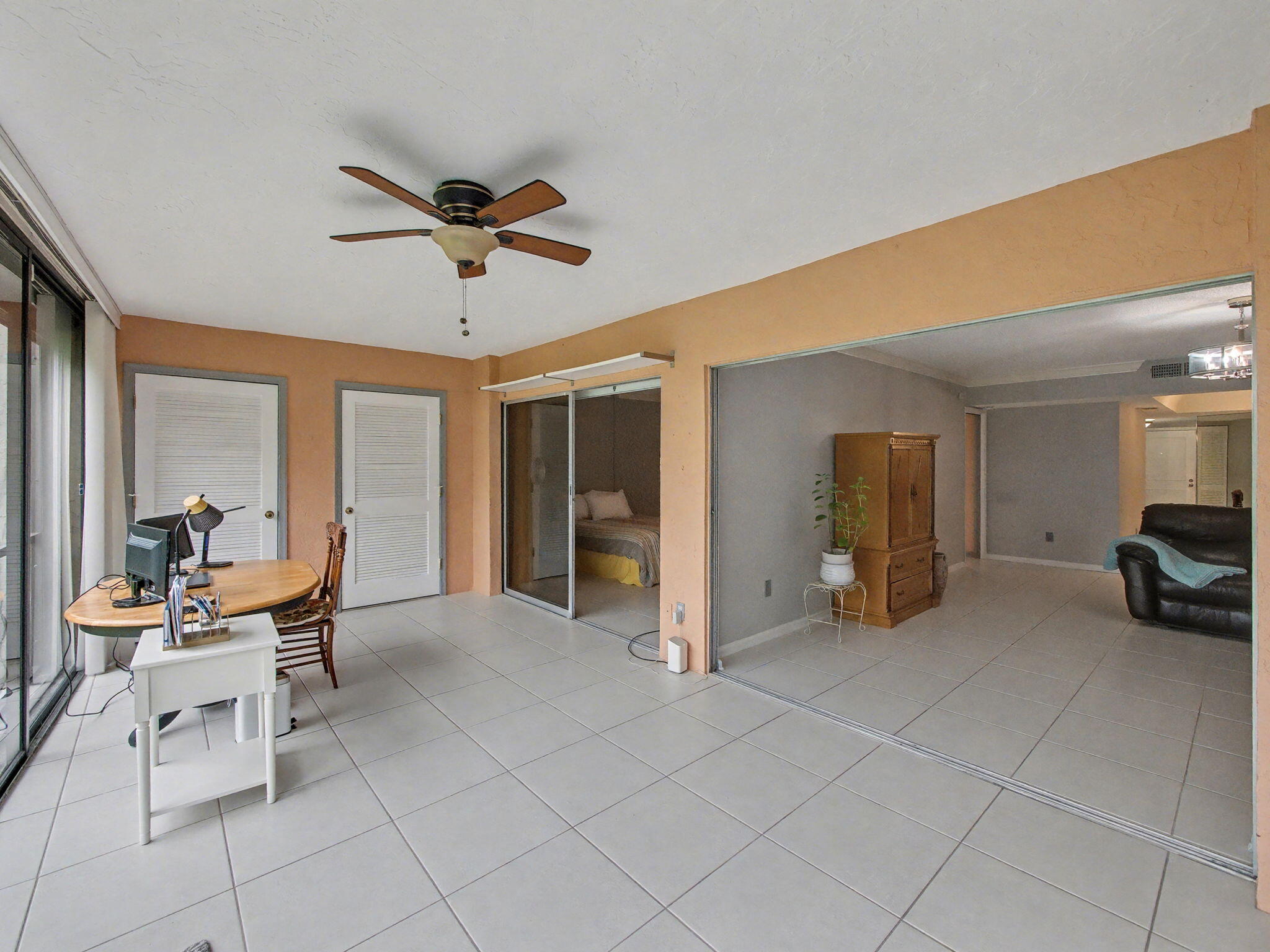9220 Southwest 14th Street, Unit 3103 Boca Raton, FL 33428 - Photo 21 of 27 a view of a livingroom with furniture and a ceiling fan