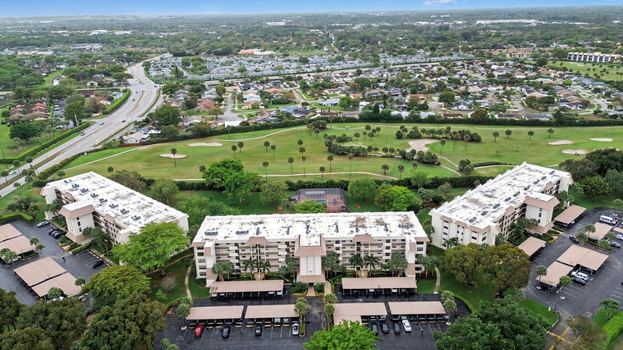 9220 Southwest 14th Street, Unit 3103 Boca Raton, FL 33428 - Photo 24 of 27 an aerial view of a city with lots of residential buildings