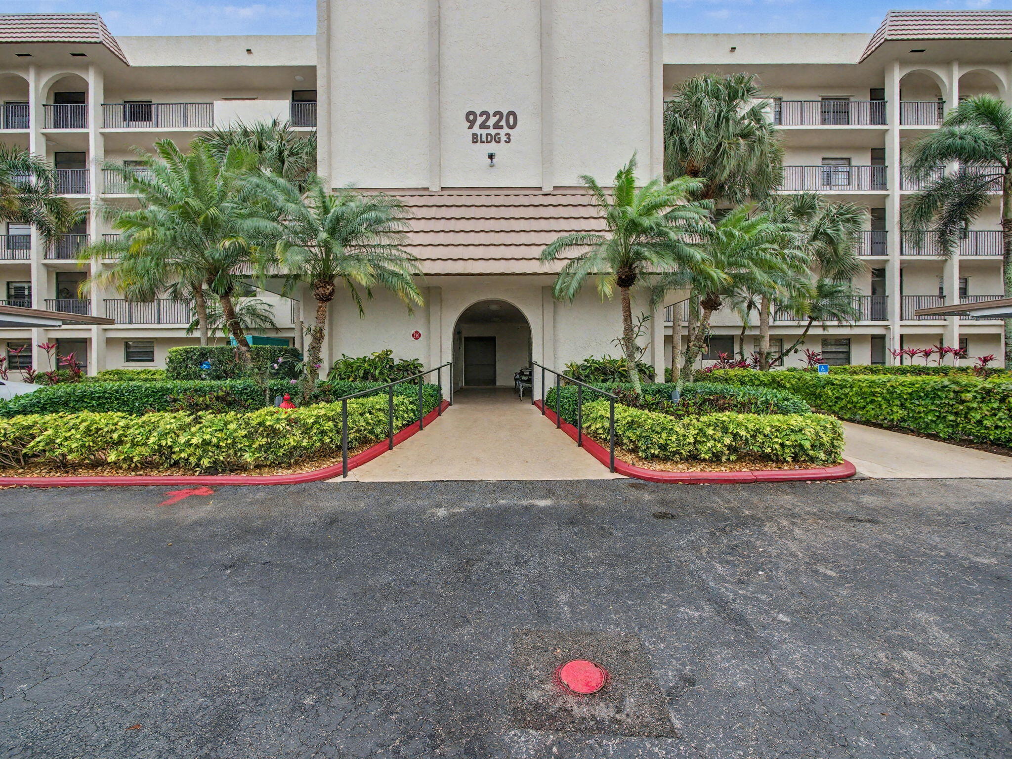 9220 Southwest 14th Street, Unit 3103 Boca Raton, FL 33428 - Photo 27 of 27 a front view of a house with yard