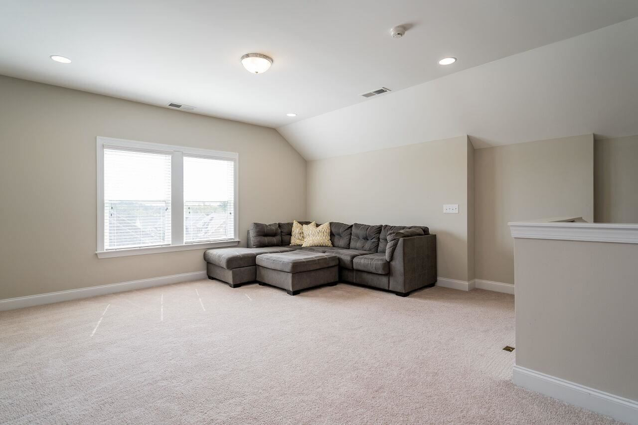 5264 Aleppo Lane Raleigh, NC 27613 - Photo 26 of 30 Third floor bonus space with full bath perfect for movie night, hangout, or another home office. Unfinished walk in attic space nearby for storage or future expansion. Third Floor