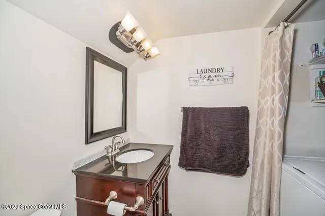 a bathroom with a sink a mirror and a shower