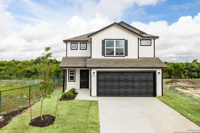 a house view with a garden space