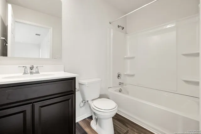 a bathroom with a sink a toilet and a bathtub