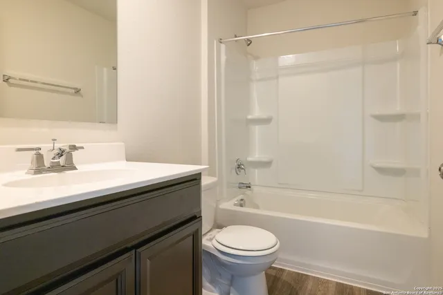 a bathroom with a sink a toilet and a bathtub