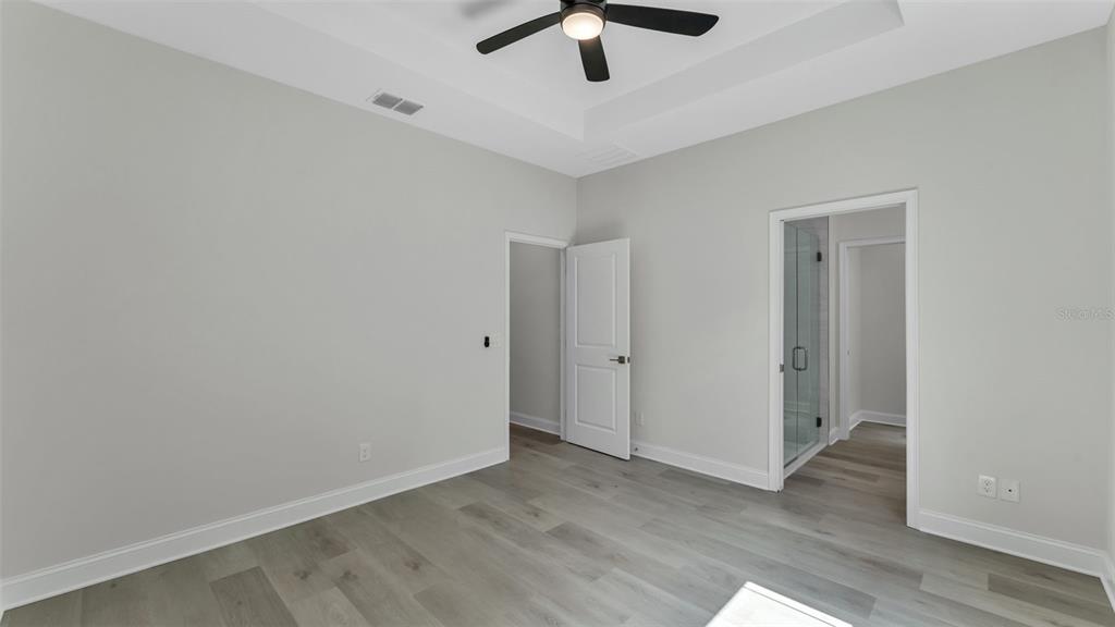 1640 Pearce Road Winter Haven, FL 33881 - Photo 17 of 33 wooden floor in an empty room