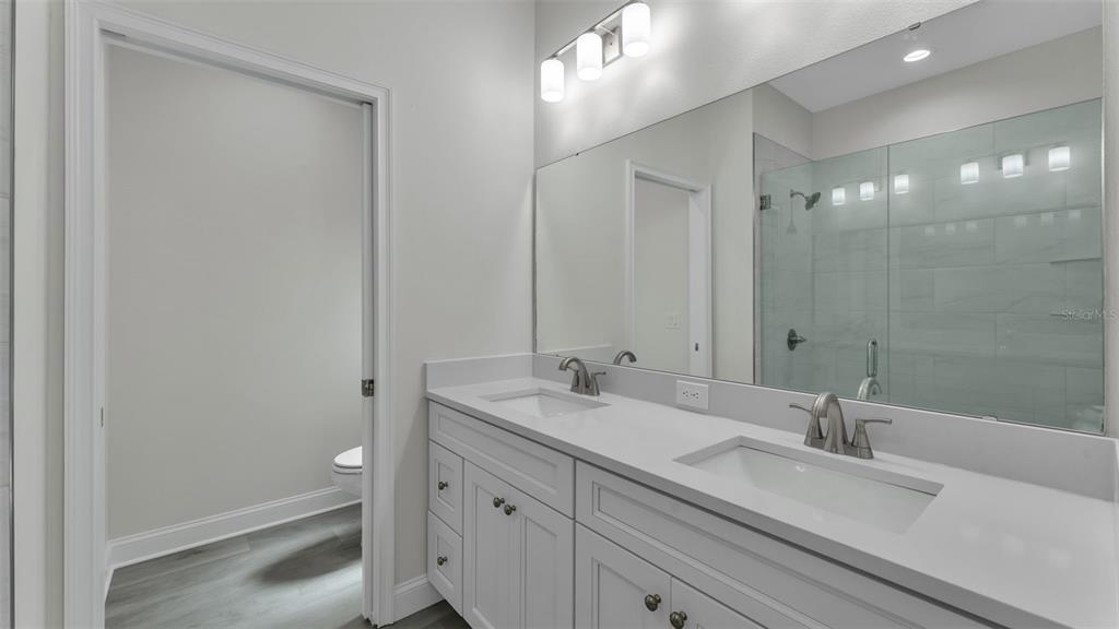 1640 Pearce Road Winter Haven, FL 33881 - Photo 19 of 33 a bathroom with a sink double vanity and a mirror