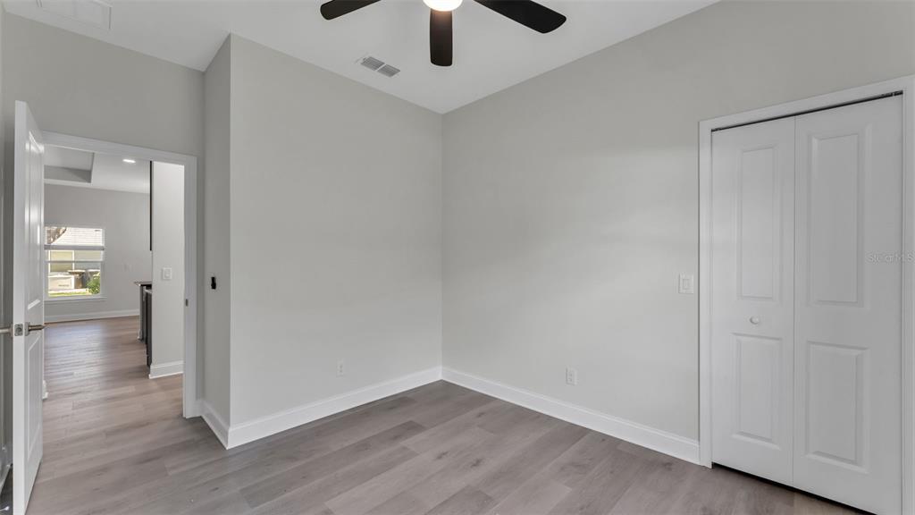 1640 Pearce Road Winter Haven, FL 33881 - Photo 23 of 33 a view of an empty room and wooden floor