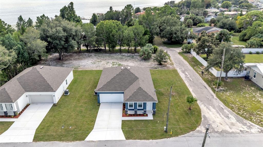 1640 Pearce Road Winter Haven, FL 33881 - Photo 30 of 33 an aerial view of a house with a garden and swimming pool