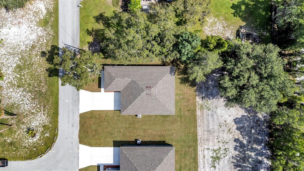 1640 Pearce Road Winter Haven, FL 33881 - Photo 31 of 33 an aerial view of a house with a yard