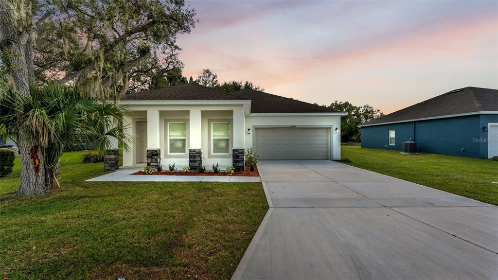 1640 Pearce Road Winter Haven, FL 33881 - Photo 33 of 33 a view of a house with a yard and a patio