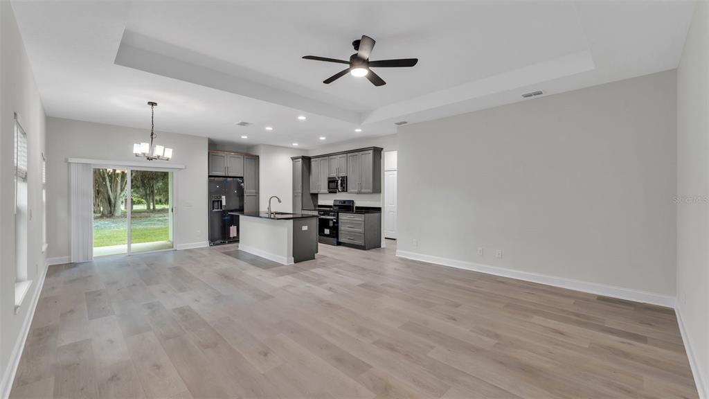 1640 Pearce Road Winter Haven, FL 33881 - Photo 4 of 33 a view of an empty room with a kitchen