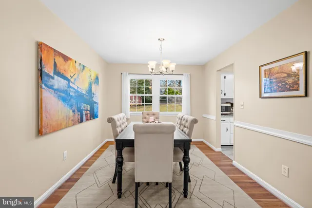a kitchen with stainless steel appliances granite countertop a refrigerator stove and sink