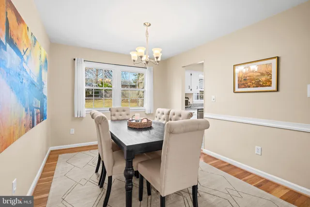 a kitchen with granite countertop a stove top oven and cabinets