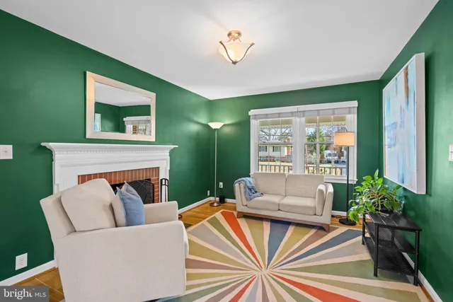 a bedroom with a bed rug and wooden floor