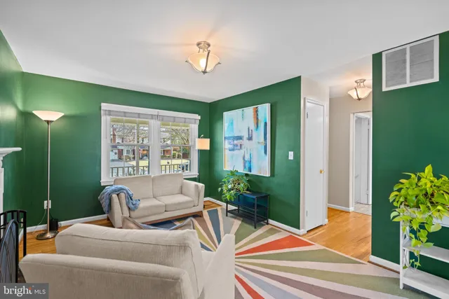 a bedroom with a bed window and a flat screen tv