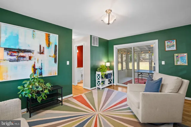 a bedroom with a bed and a night stand