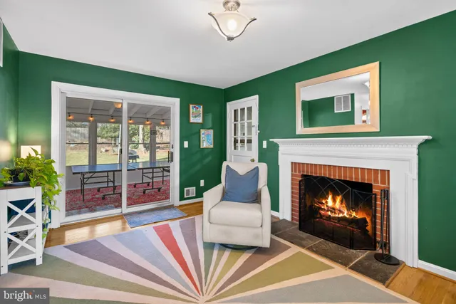 a bathroom with a sink a toilet and a large mirror