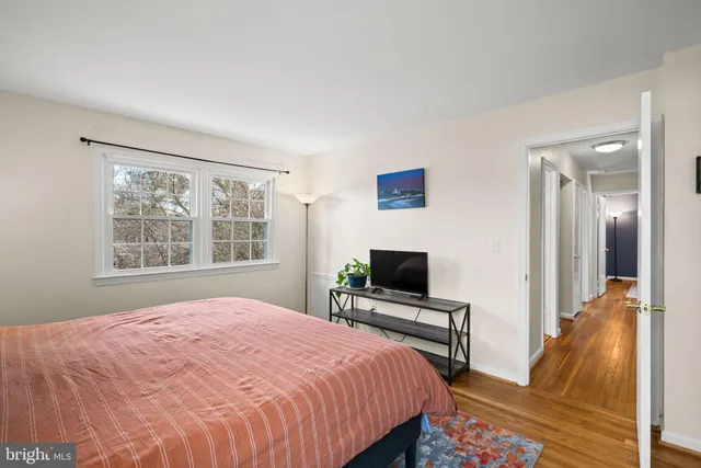 a view of a livingroom with workspace and a couch