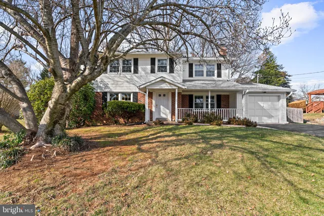 a view of an entryway with wooden floor and a livingroom view