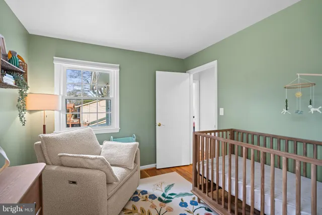 a living room with furniture rug and a table