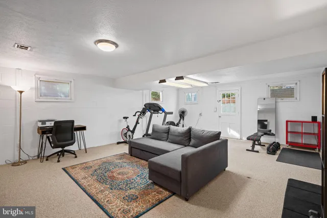 a front view of a house with swimming pool and porch