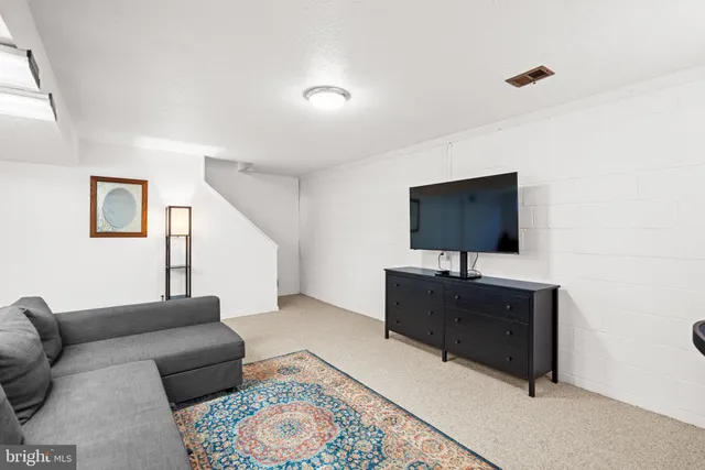 a view of a house with backyard porch and sitting area