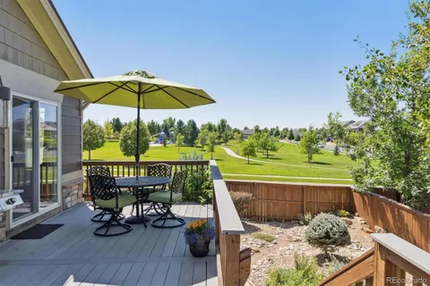 a view of a chairs and table in the balcony