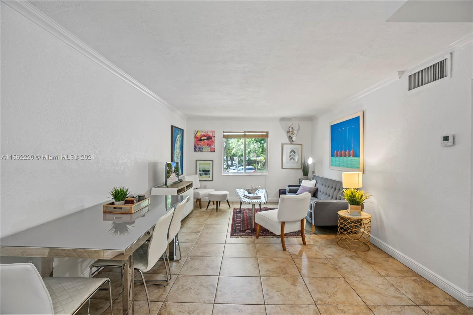 8617 Southwest 68th Court, Unit 24 Pinecrest, FL 33156 - Photo 7 of 22 a workspace with furniture and window