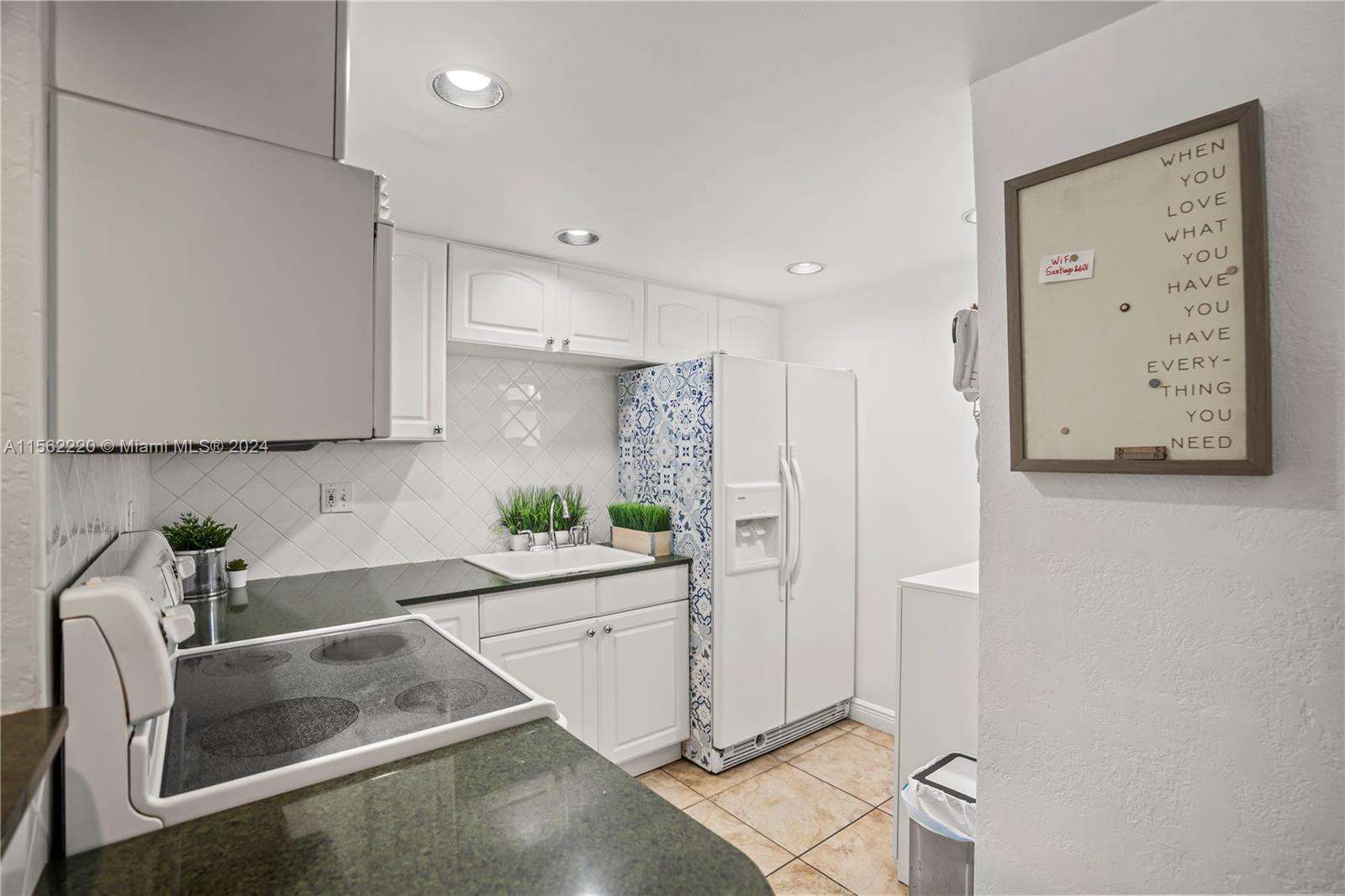8617 Southwest 68th Court, Unit 24 Pinecrest, FL 33156 - Photo 10 of 22 a kitchen with a sink and cabinets