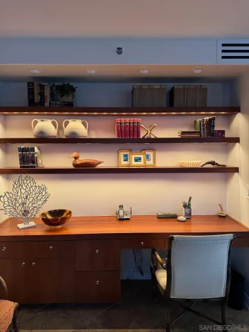 a kitchen with a table and cabinets