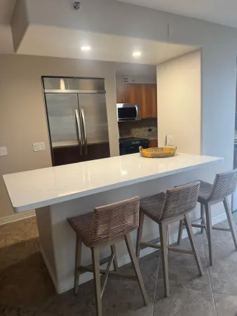 a kitchen with a table and chairs