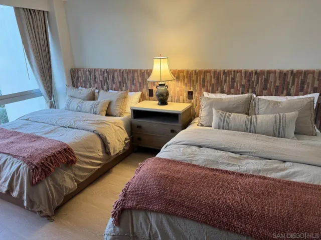 a bedroom with bed and window